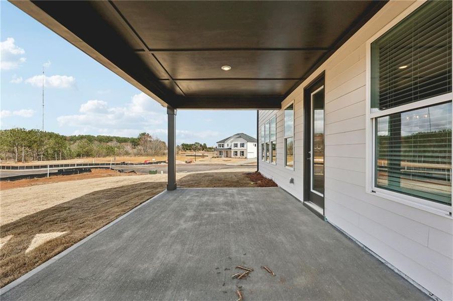 Exterior details and patio area of a home in River Pointe, Monroe (Image 3).