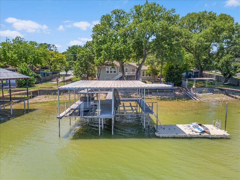Dock area featuring a water view and boat lift