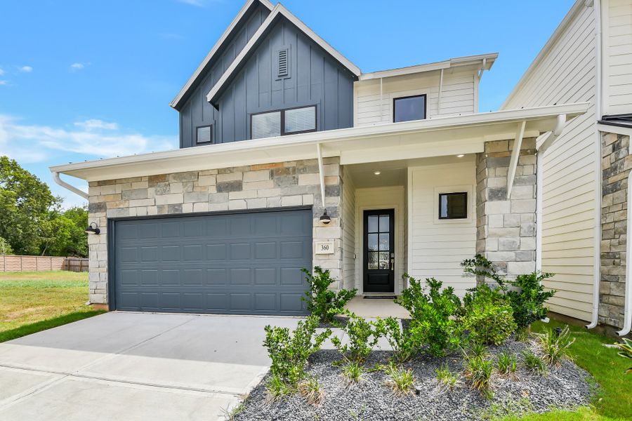 Front exterior of a new home in Summer Place  35', Montgomery, TX, highlighting curb appeal (Image 29).