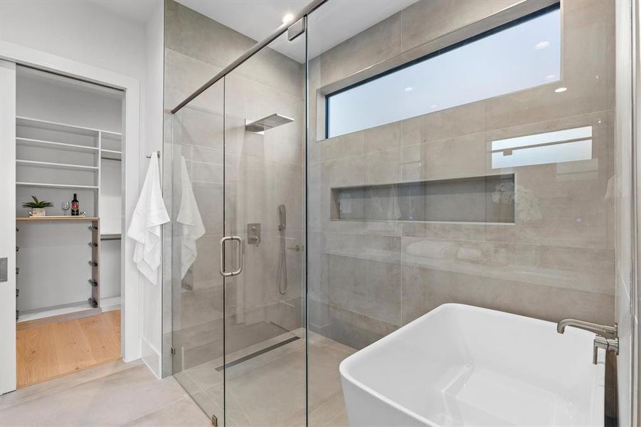 Bathroom featuring plus walk in shower and tile patterned floors