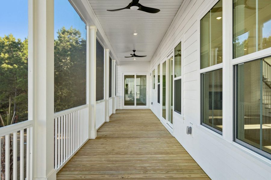 Exterior details and patio area of a home in Overlook at Copahee Sound, Awendaw (Image 44).