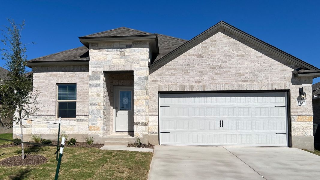 Front exterior of a new home in Three Creeks - Colt Creek, Belton, TX, highlighting curb appeal (Image 1). Front exterior of a new home in Three Creeks - Colt Creek, Belton, TX, highlighting curb appeal (Image 1).