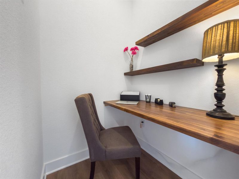 A built-in office nook just off the entry, perfect for working from home without giving up living space. Clean, functional, and tucked away. A built-in office nook just off the entry, perfect for working from home without giving up living space. Clean, functional, and tucked away.