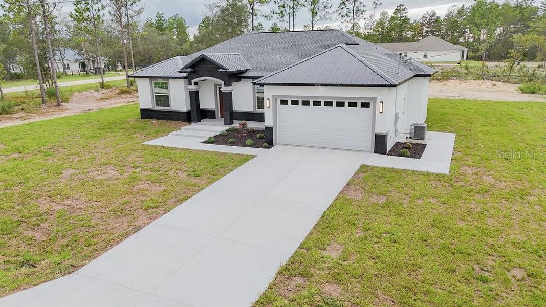 Front exterior of a new home in , Dunnellon, FL, highlighting curb appeal (Image 2). Front exterior of a new home in , Dunnellon, FL, highlighting curb appeal (Image 2).