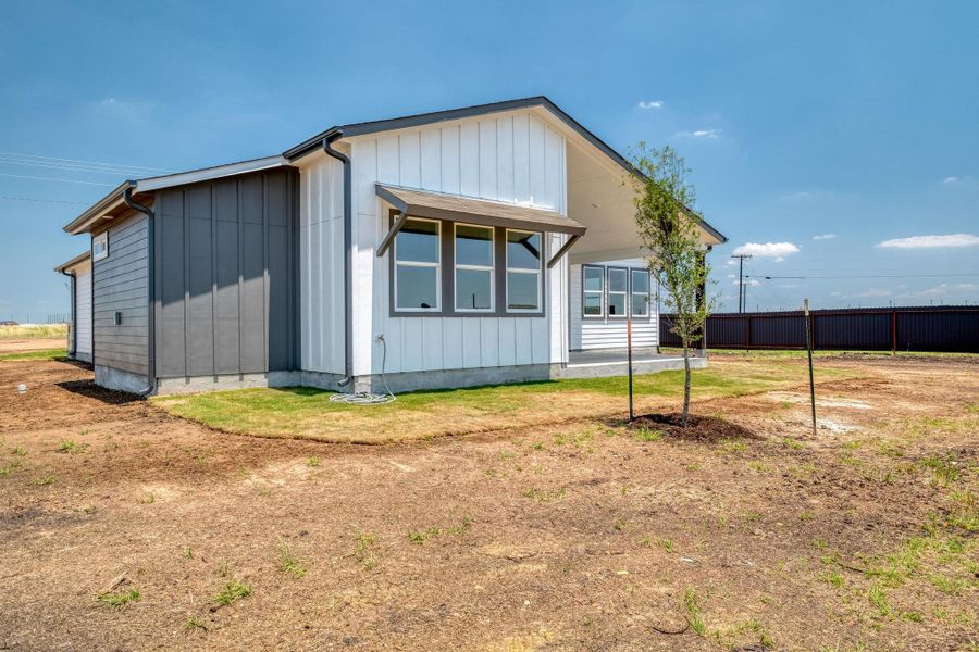 Front exterior of a new home in , Del Valle, TX, highlighting curb appeal (Image 20).