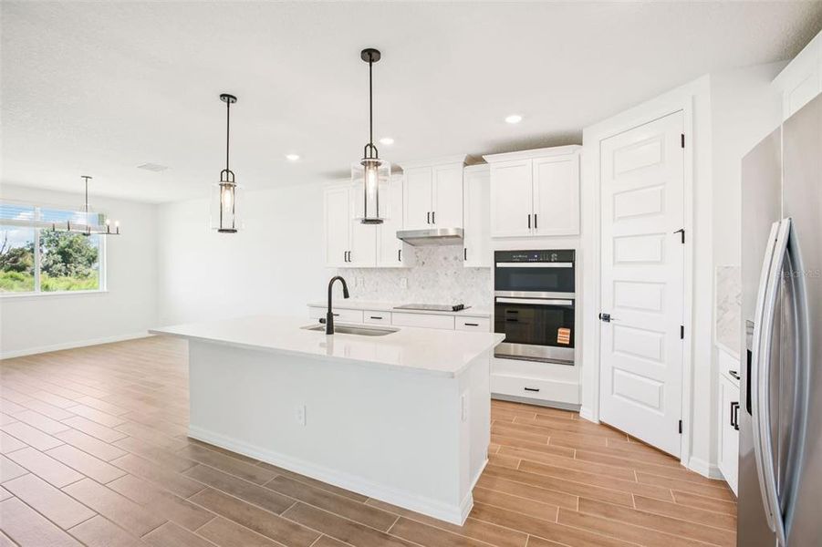 Furnished interior view inside a new home in Two Rivers - Signature Series, Zephyrhills (Image 6).