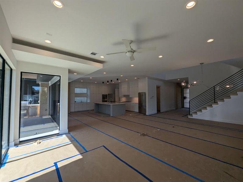 Expansive open floor plan on main level connecting various living spaces.