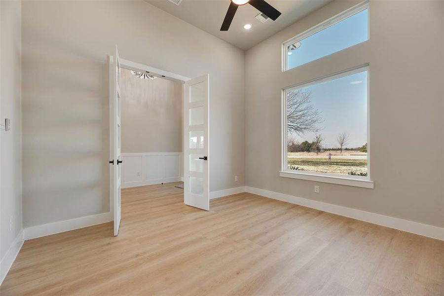 Unfurnished bedroom featuring light wood-style floors, a ceiling fan, and recessed lighting