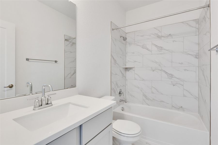 Full bathroom featuring shower / tub combination and vanity Full bathroom featuring shower / tub combination and vanity