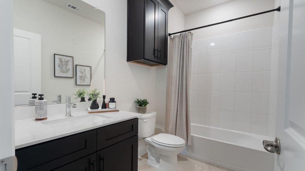 Representative furnished interior of a home built from the Picasso by D.R. Horton in Waterbend, Euless (Image 10).