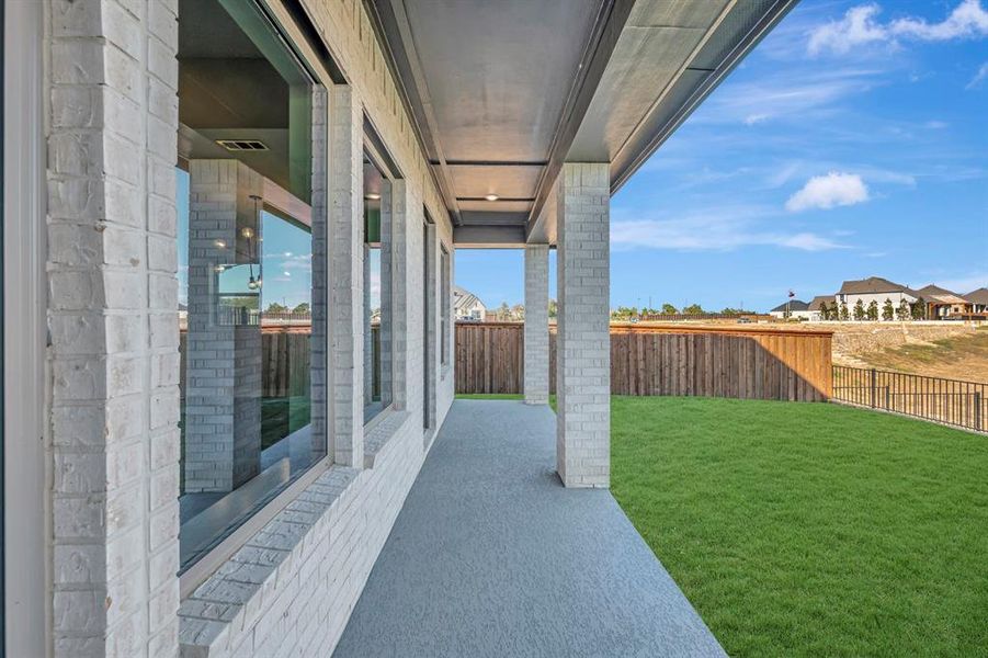 Exterior details and patio area of a home in Northshore at Lakewood Village - Classic Series, Lakewood Village (Image 2).