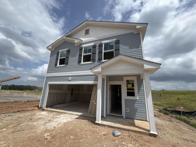 Front exterior of a new home in Declaration Homes, Grovetown, GA, highlighting curb appeal (Image 2). Front exterior of a new home in Declaration Homes, Grovetown, GA, highlighting curb appeal (Image 2).