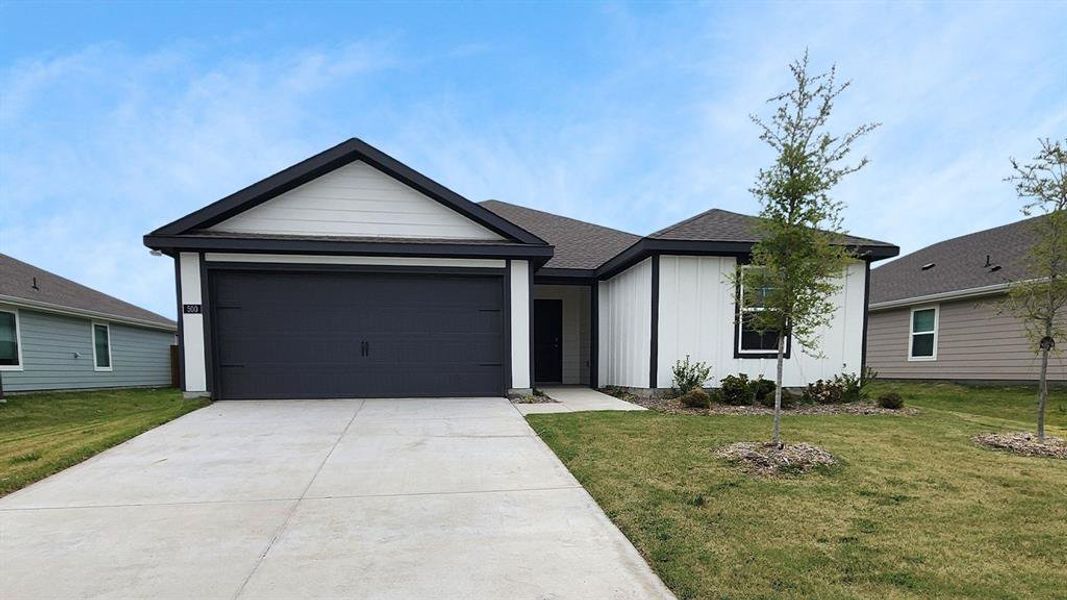 Contemporary single-story residence featuring a two-car garage, concrete driveway, and a combination of horizontal and vertical siding Contemporary single-story residence featuring a two-car garage, concrete driveway, and a combination of horizontal and vertical siding