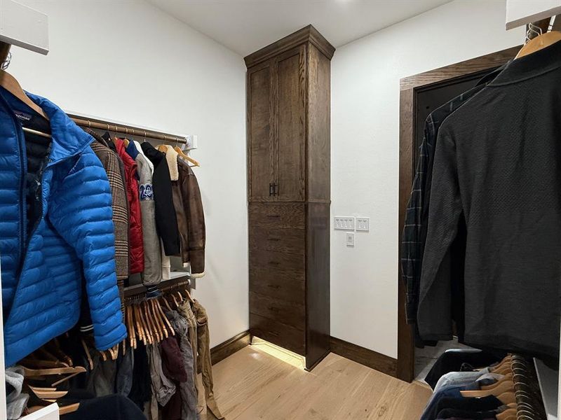 Walk in closet featuring light wood-style flooring