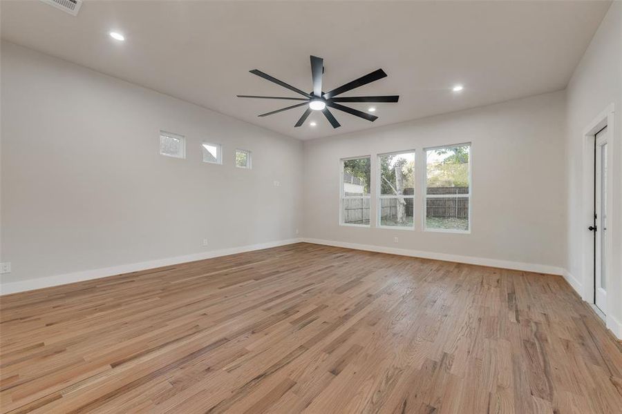 Unfurnished room with light wood-type flooring and ceiling fan