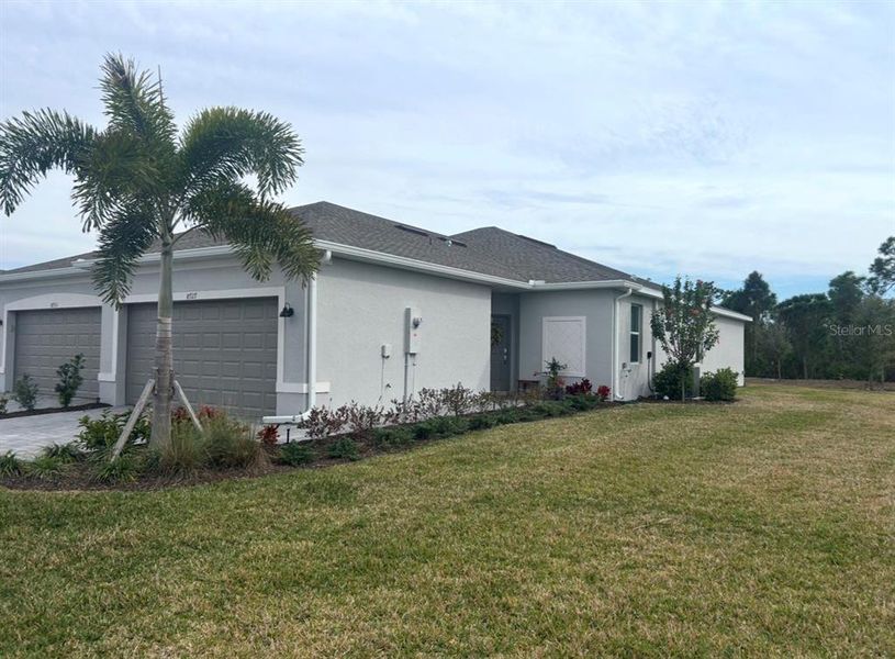 Front exterior of a new home in , Englewood, FL, highlighting curb appeal (Image 14).