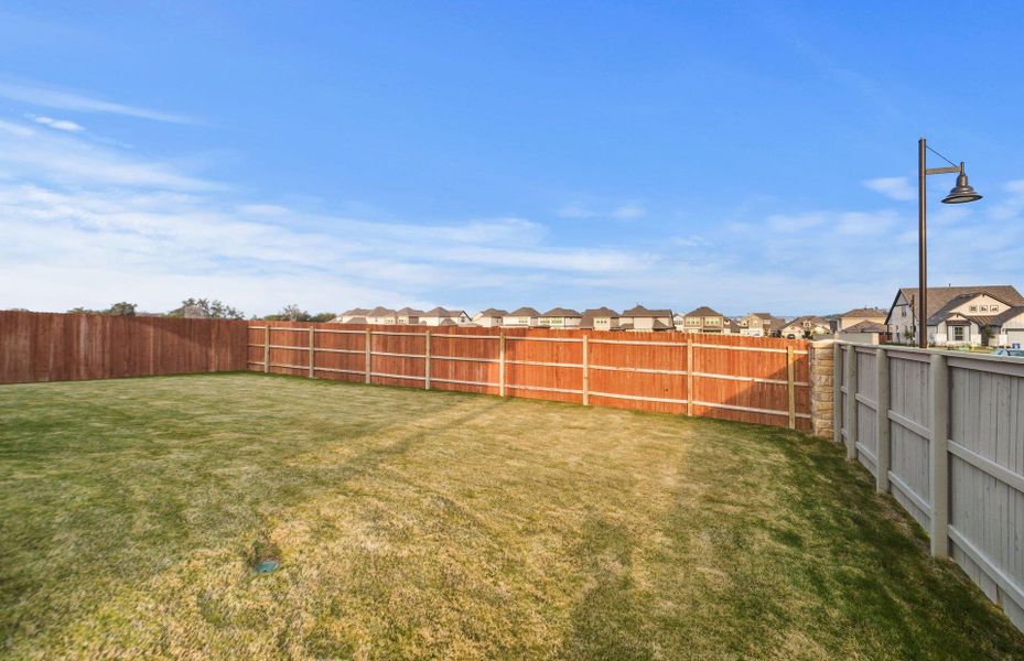 Exterior details and patio area of a home in Saddleback at Santa Rita Ranch, Liberty Hill (Image 3).