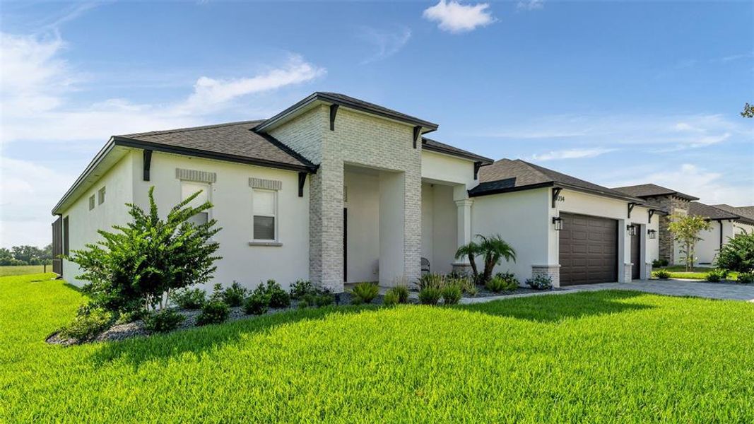 Front exterior of a new home in , Lakeland, FL, highlighting curb appeal (Image 21). Front exterior of a new home in , Lakeland, FL, highlighting curb appeal (Image 21).