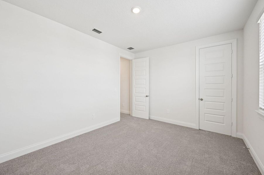 Spacious, unfurnished interior of a new home in Brystol at Wylder - Reserve Series, Port St. Lucie (Image 18).