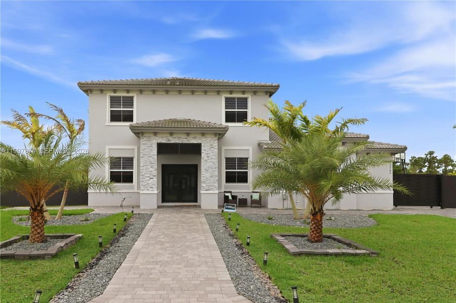 Front exterior of a new home in , Homestead, FL, highlighting curb appeal (Image 22).