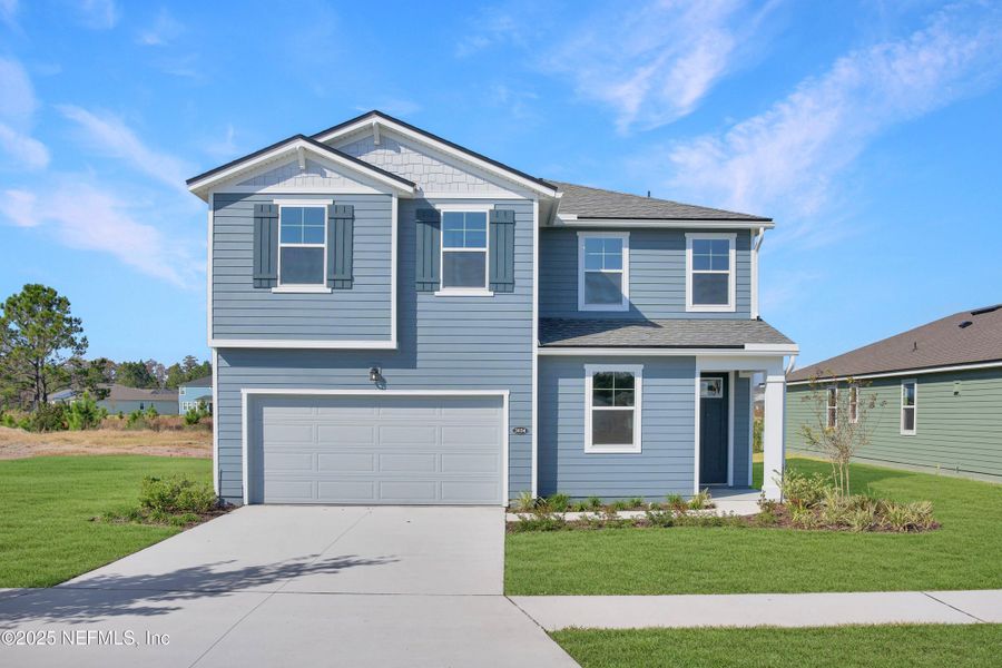 Front exterior of a new home in Lakes at Bella Lago, Green Cove Springs, FL, highlighting curb appeal (Image 1). Front exterior of a new home in Lakes at Bella Lago, Green Cove Springs, FL, highlighting curb appeal (Image 1).