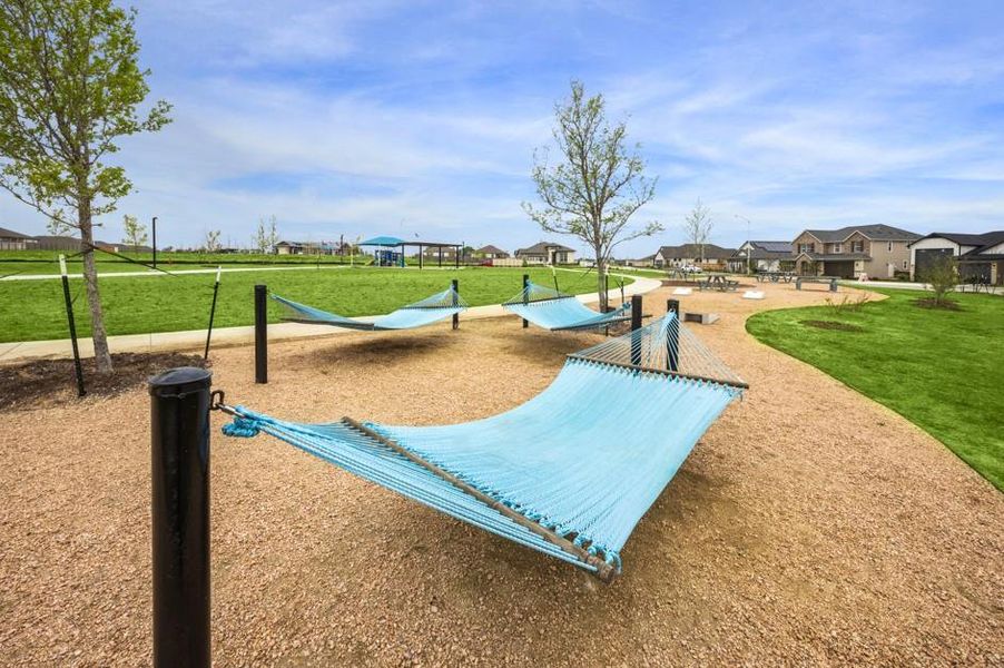View of home's community with a residential view, a lawn, and a dog friendly area View of home's community with a residential view, a lawn, and a dog friendly area