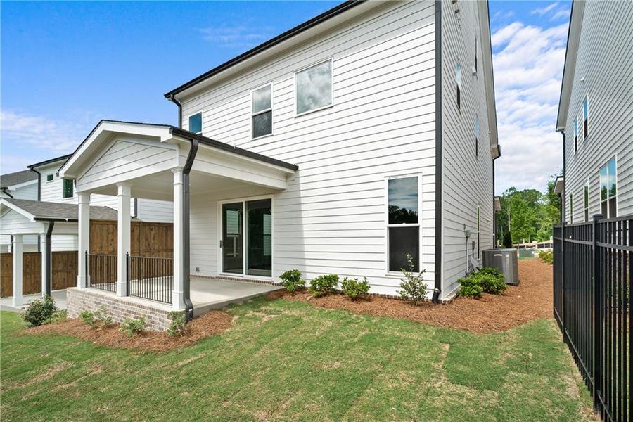 Front exterior of a new home in Palisades Single Family, Cumming, GA, highlighting curb appeal (Image 1). Front exterior of a new home in Palisades Single Family, Cumming, GA, highlighting curb appeal (Image 1).