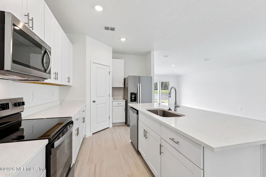 Furnished interior view inside a new home in Flagler Village - Signature Series, Palm Coast (Image 4).