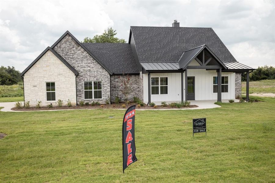 Front exterior of a new home in , Celeste, TX, highlighting curb appeal (Image 22).