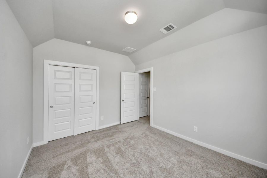 Generously sized secondary bedrooms featuring spacious closets, soft and inviting carpeting underfoot, large windows allowing plenty of natural light, and the added touch of privacy blinds for your personal retreat. Generously sized secondary bedrooms featuring spacious closets, soft and inviting carpeting underfoot, large windows allowing plenty of natural light, and the added touch of privacy blinds for your personal retreat.