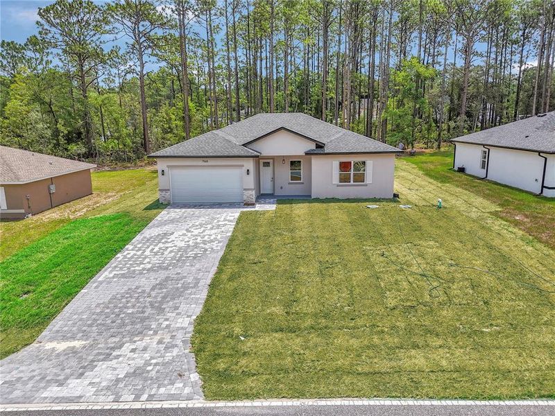 Front exterior of a new home in , Citrus Springs, FL, highlighting curb appeal (Image 25). Front exterior of a new home in , Citrus Springs, FL, highlighting curb appeal (Image 25).