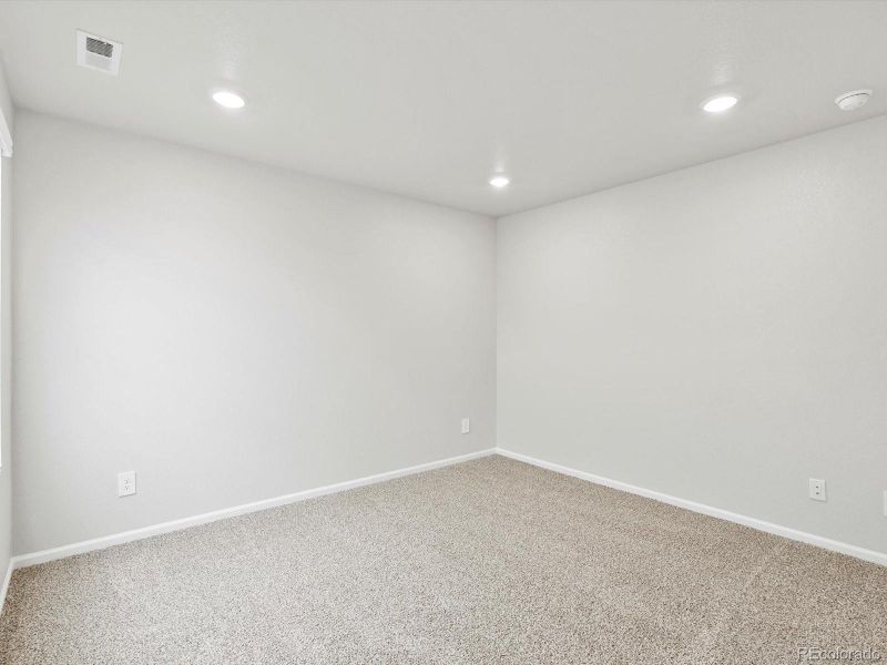 Spacious, unfurnished interior of a new home in Buffalo Highlands: The Flora Collection, Commerce City (Image 21).