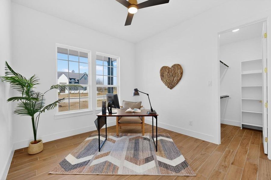 Office/Bedroom with ceiling fan and wood tiled floors