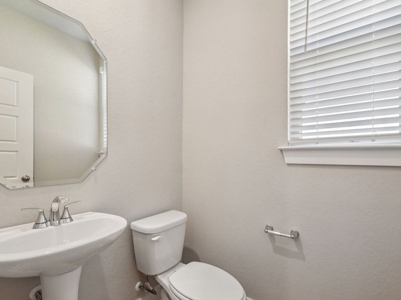 Powder room in the Red River floorplan at a Meritage Homes community.