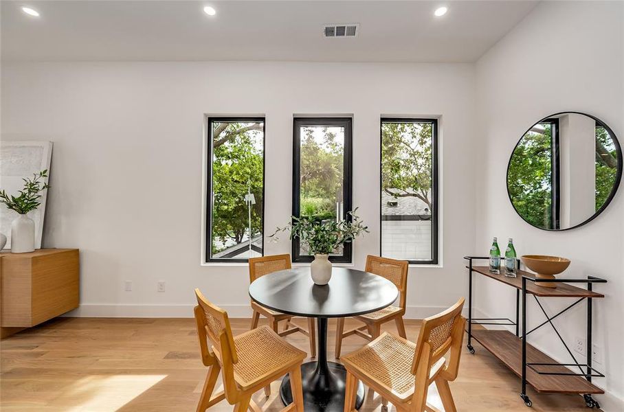 Dining area featuring recessed lighting and light wood-style floors Dining area featuring recessed lighting and light wood-style floors