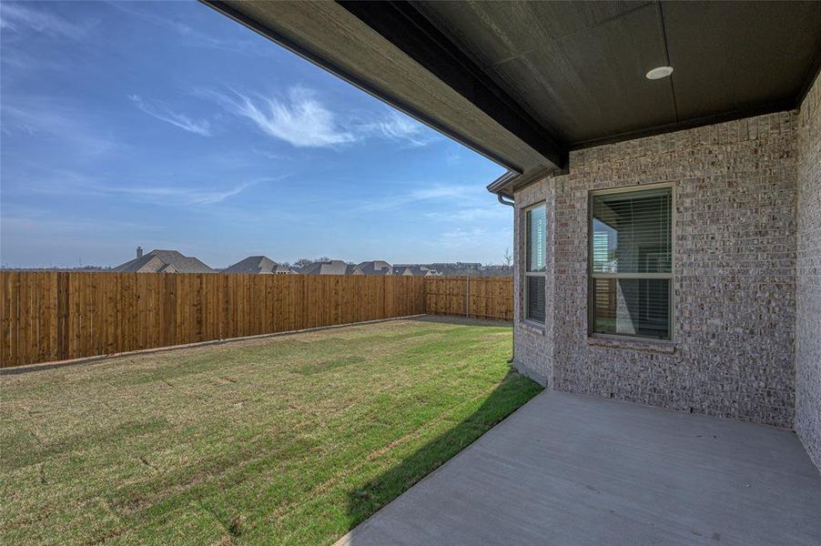 Exterior details and patio area of a home in Estates at Baker Park, Sherman (Image 4).
