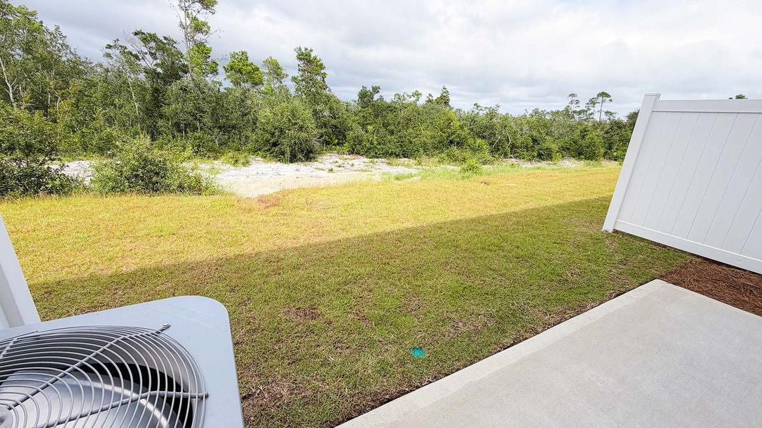 Exterior details and patio area of a home in Salt Creek Townhomes at Mexico Beach, Mexico Beach (Image 21).