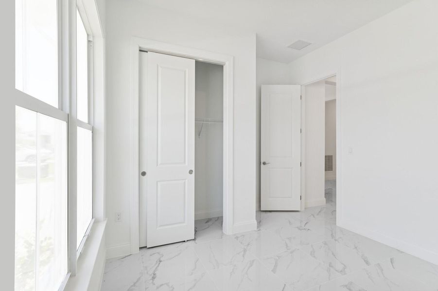 Furnished interior view inside a new home in Salerno Reserve - Single Family, Stuart (Image 33). Furnished interior view inside a new home in Salerno Reserve - Single Family, Stuart (Image 33).