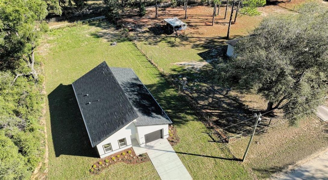 Front exterior of a new home in , Dunnellon, FL, highlighting curb appeal (Image 19).