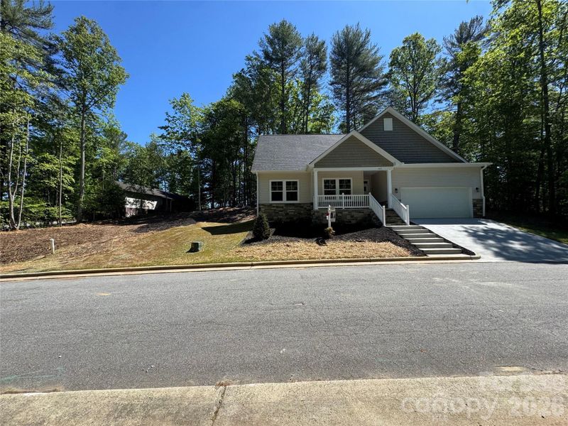 Front exterior of a new home in , Lenoir, NC, highlighting curb appeal (Image 17).