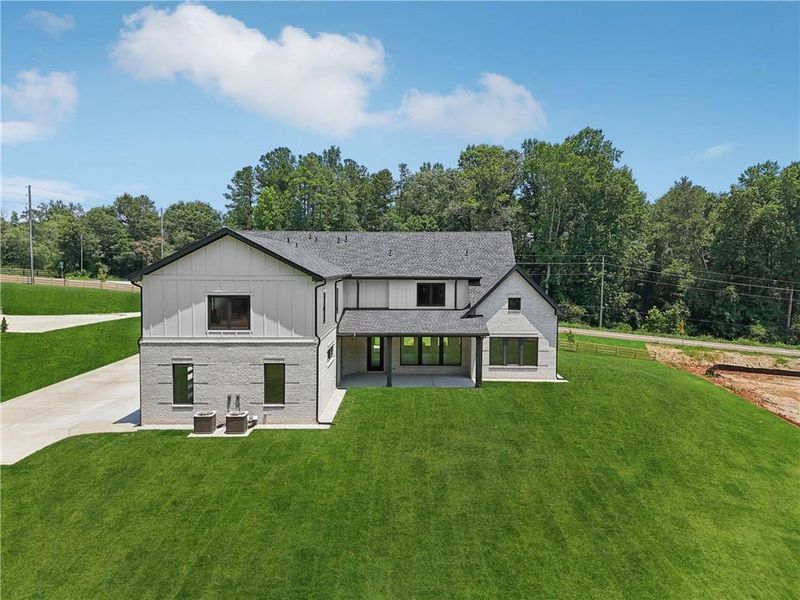 Front exterior of a new home in , Braselton, GA, highlighting curb appeal (Image 55).