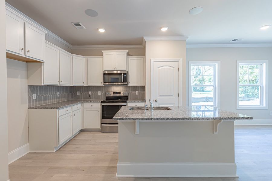 Representative furnished interior of a home built from the Habersham II by Great Southern Homes in Old Charleston Acres, Pelion (Image 27).
