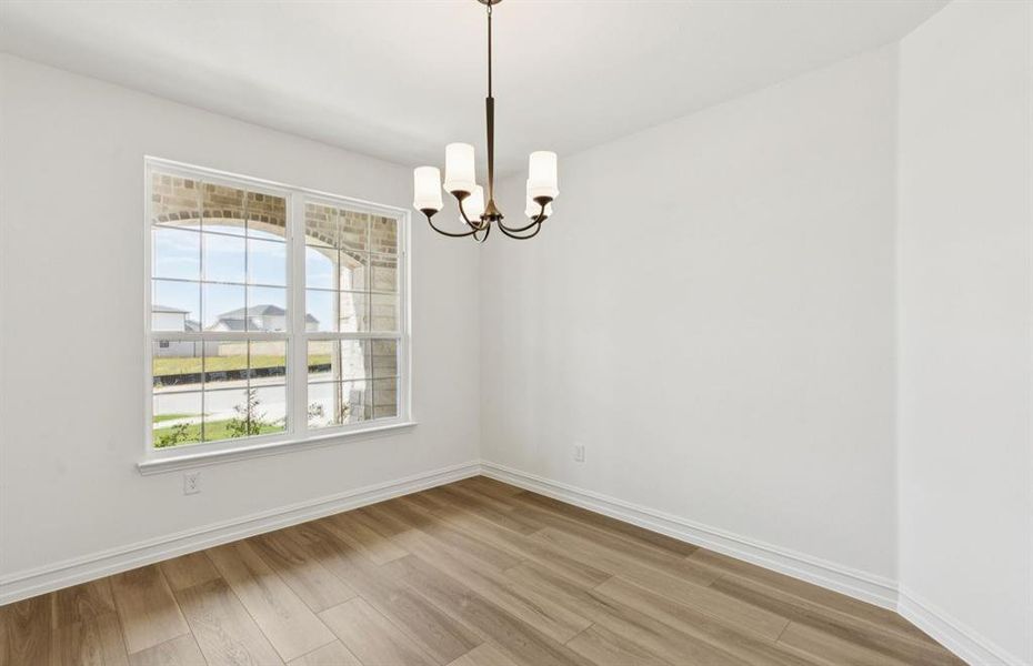 Formal dining room with large windows Formal dining room with large windows