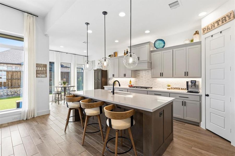 Upgraded Painted Shaker Style Kitchen Cabinets with Stained Island.