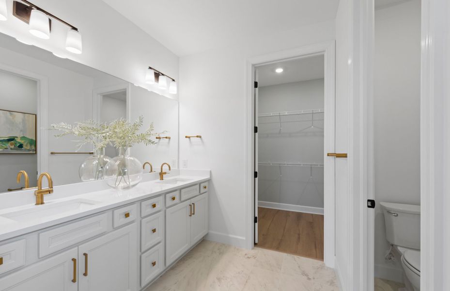 Owner's bathroom with dual sink vanity