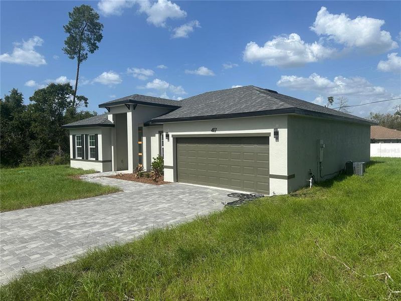 Front exterior of a new home in , Ocala, FL, highlighting curb appeal (Image 2).