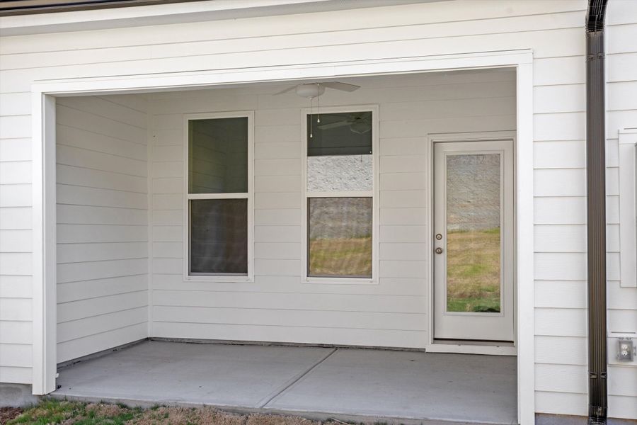 Exterior details and patio area of a home in Ovation at Sweetbrier, Durham (Image 3).