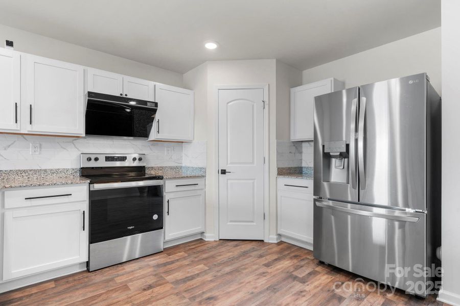 Furnished interior view inside a new home in , Lenoir (Image 17).