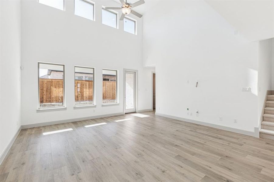 Your new family room is flooded with natural light from a dual stacked wall of windows! Your new family room is flooded with natural light from a dual stacked wall of windows!