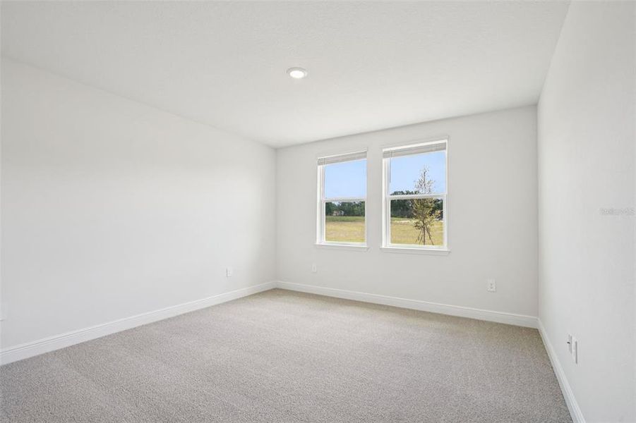 Spacious, unfurnished interior of a new home in The Reserve at Hammock Oaks - Signature Series, Lady Lake (Image 13).